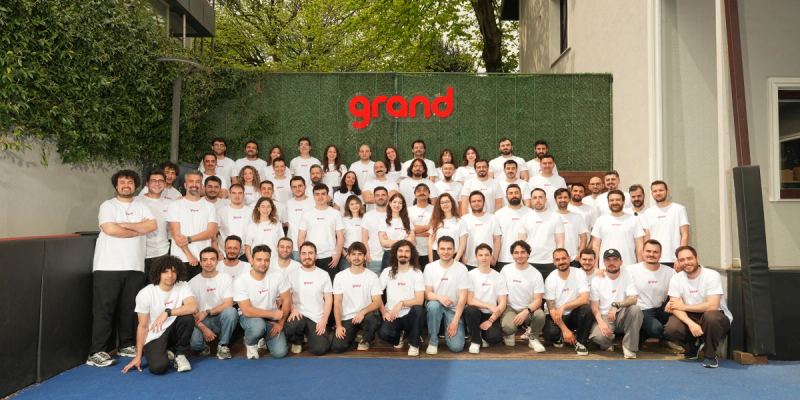 Grand Games team members photographed together after the company's Series B funding round.
