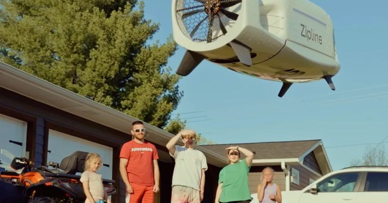 Zipline drone delivery system operating quietly above a neighborhood.