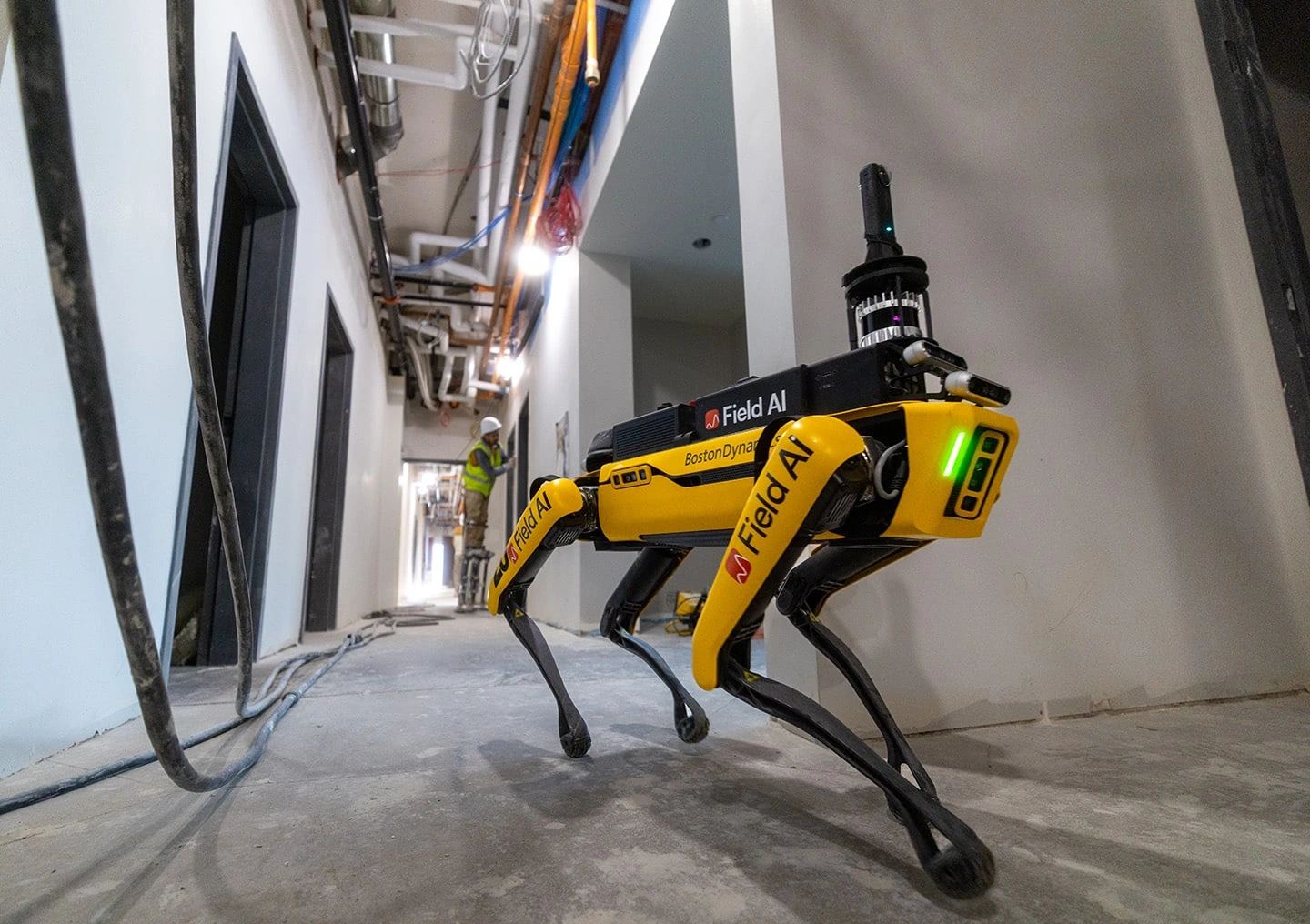 Boston Dynamics Spot robot and FieldAI imagery for autonomous industrial robotics.