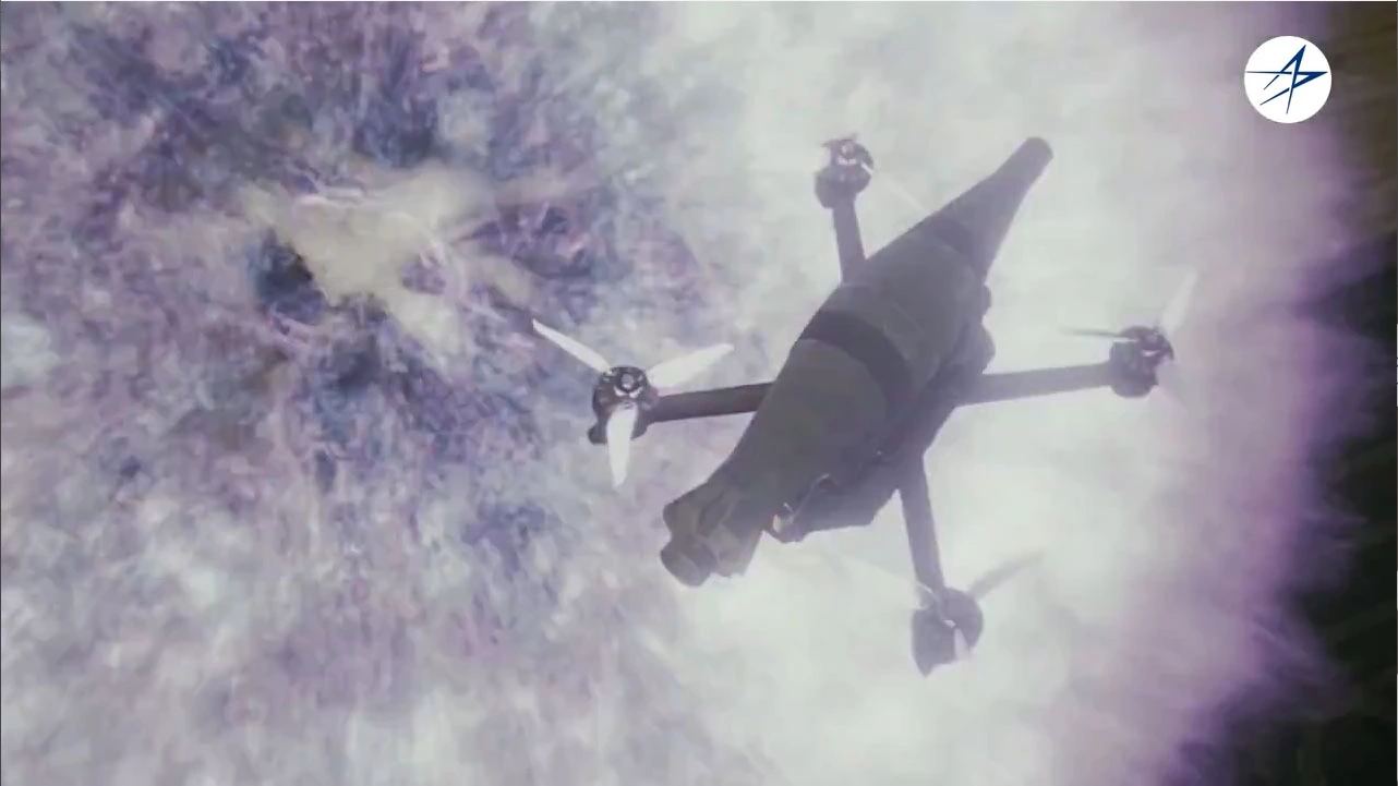 Lockheed Martin MORFIUS X-Rotor counter-drone system flying through a microwave-effect scene