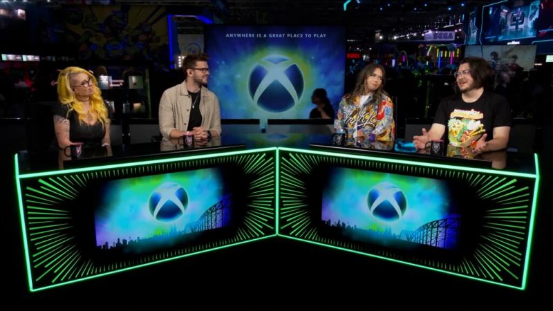 Пульт трансляции Xbox на мероприятии gamescom с игровыми экранами и зеленым освещением