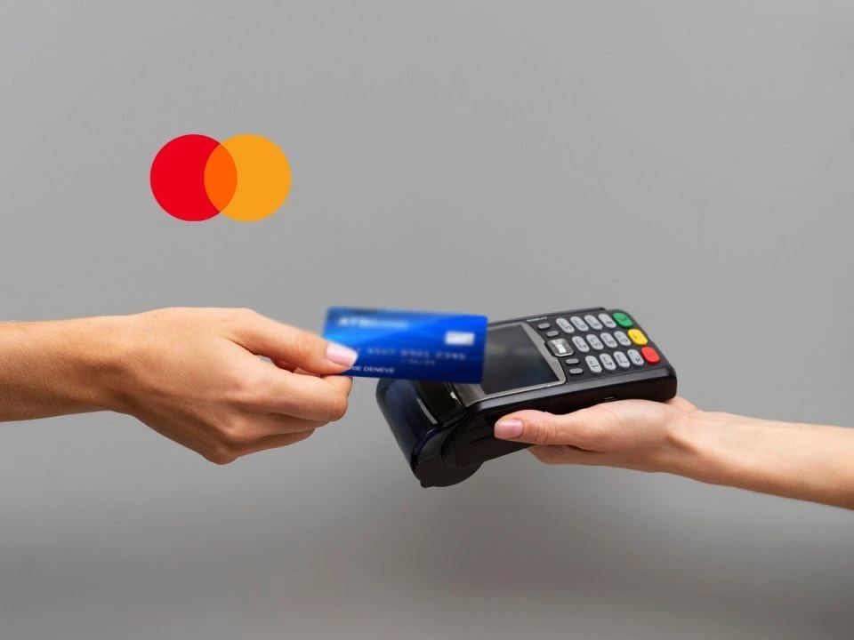 Mastercard financial results presentation screen with digital payment network imagery