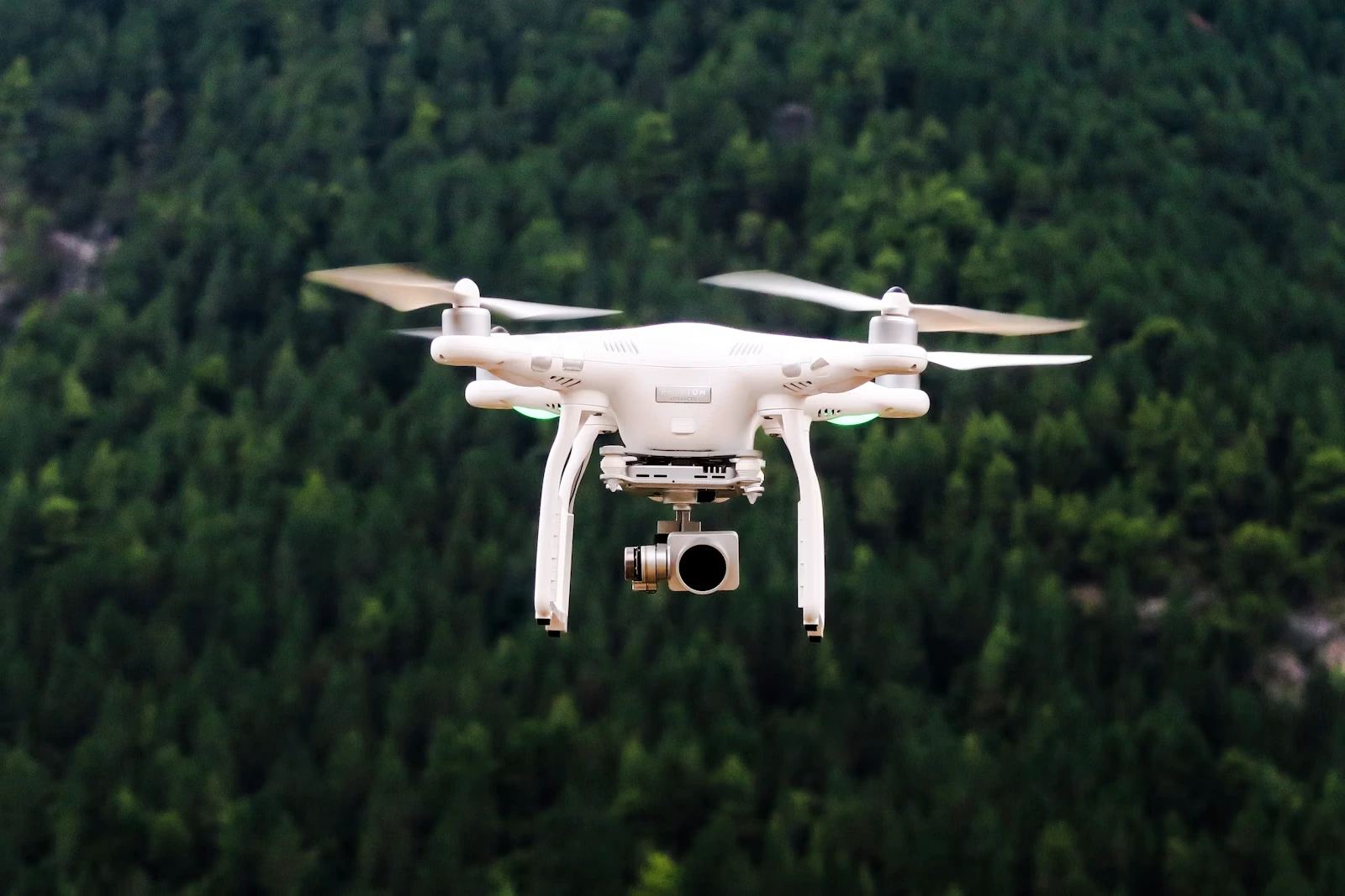 Autonomous drone flying outdoors above a landscape
