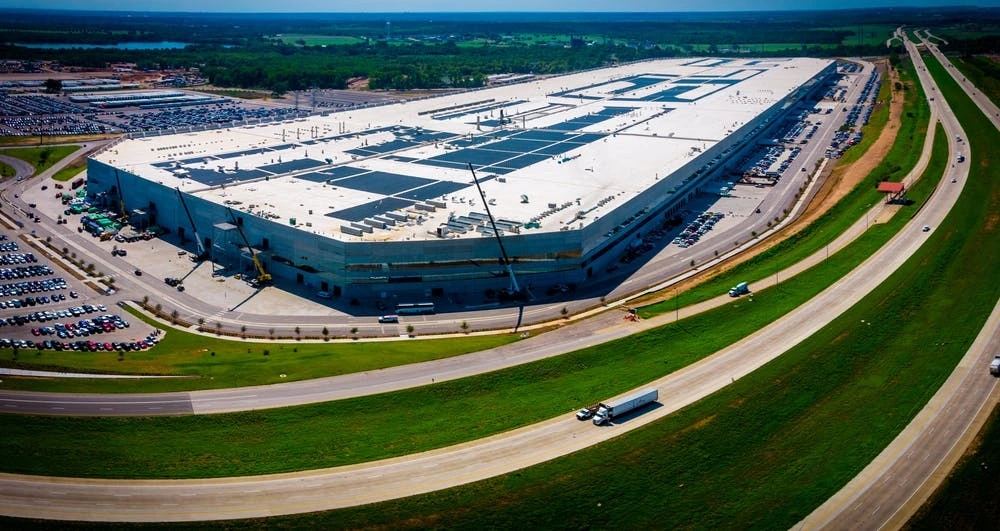 Large industrial manufacturing complex representing the scale of a semiconductor campus.
