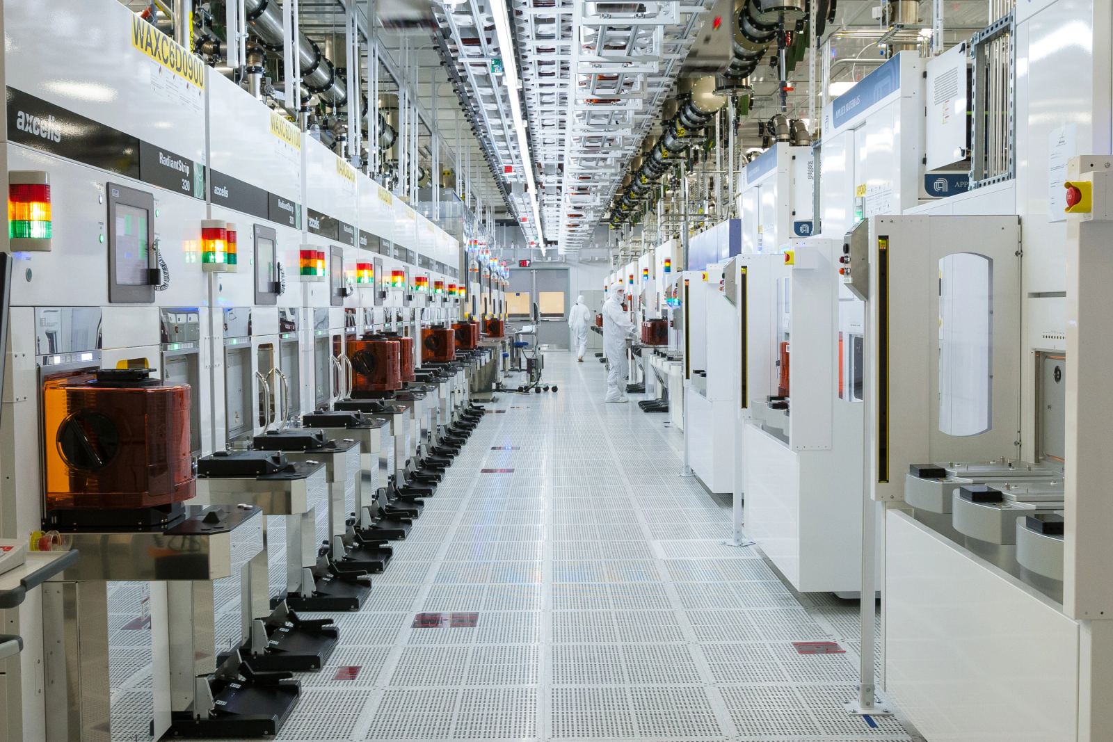 Automated semiconductor design and fabrication equipment representing electronic design automation software.