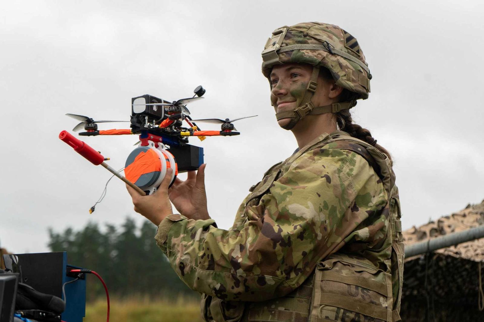 Marines preparing a small unmanned aircraft during a counter-drone training exercise.