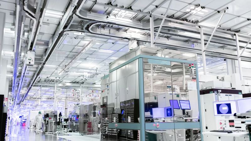 Semiconductor wafer manufacturing equipment in a modern fabrication facility.