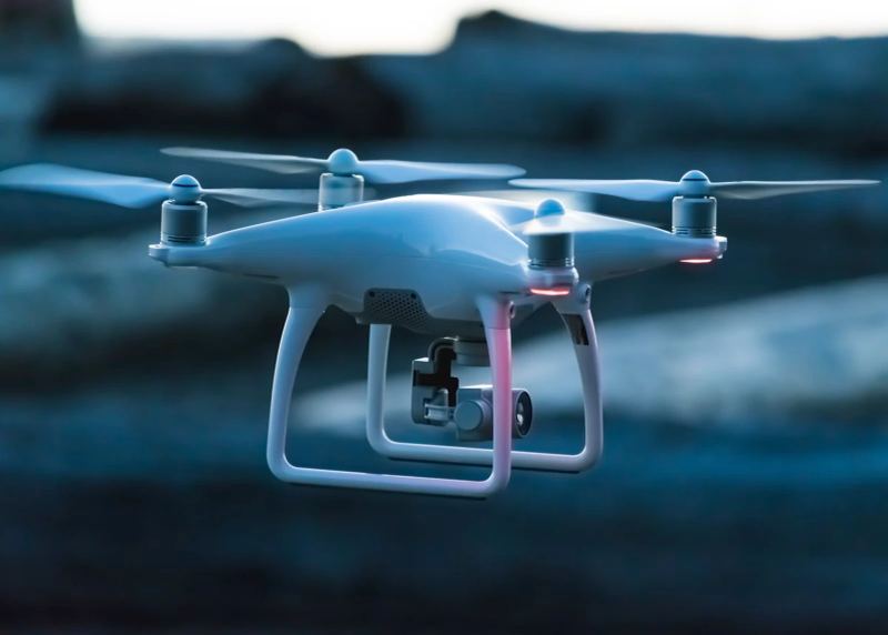 Drone flying over an industrial landscape representing propulsion supply chain.