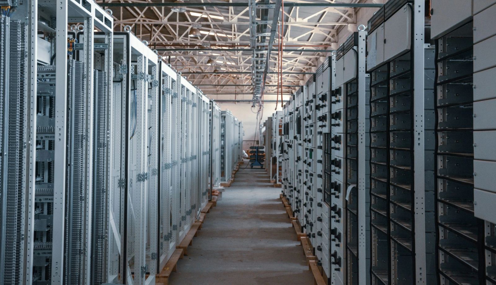 Neutral data center server aisle representing inference-era hardware economics