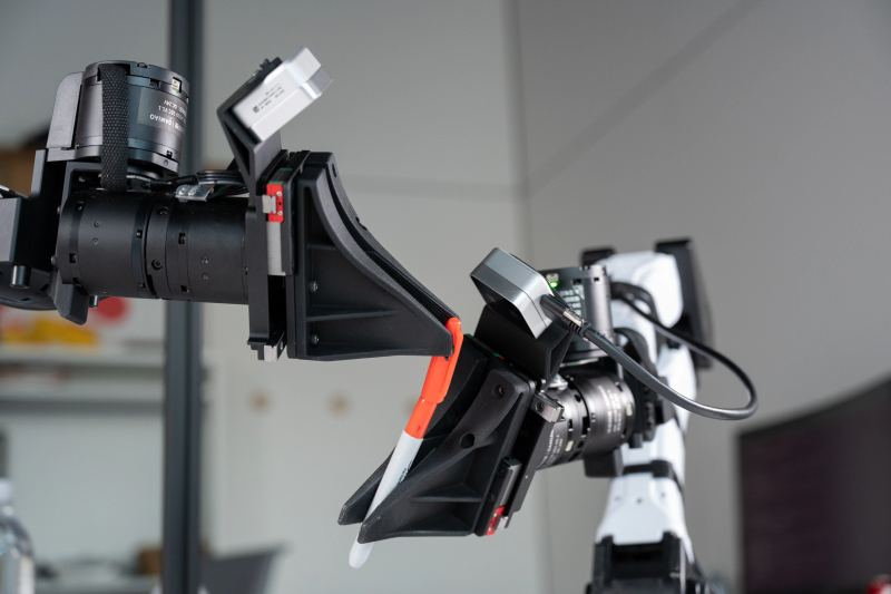 XDOF co-founders Philipp Wu and Fred Shentu demonstrating their robotic teleoperation system hardware