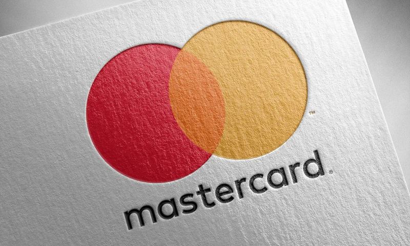 Mastercard corporate emblem and digital financial payments technology concept.
