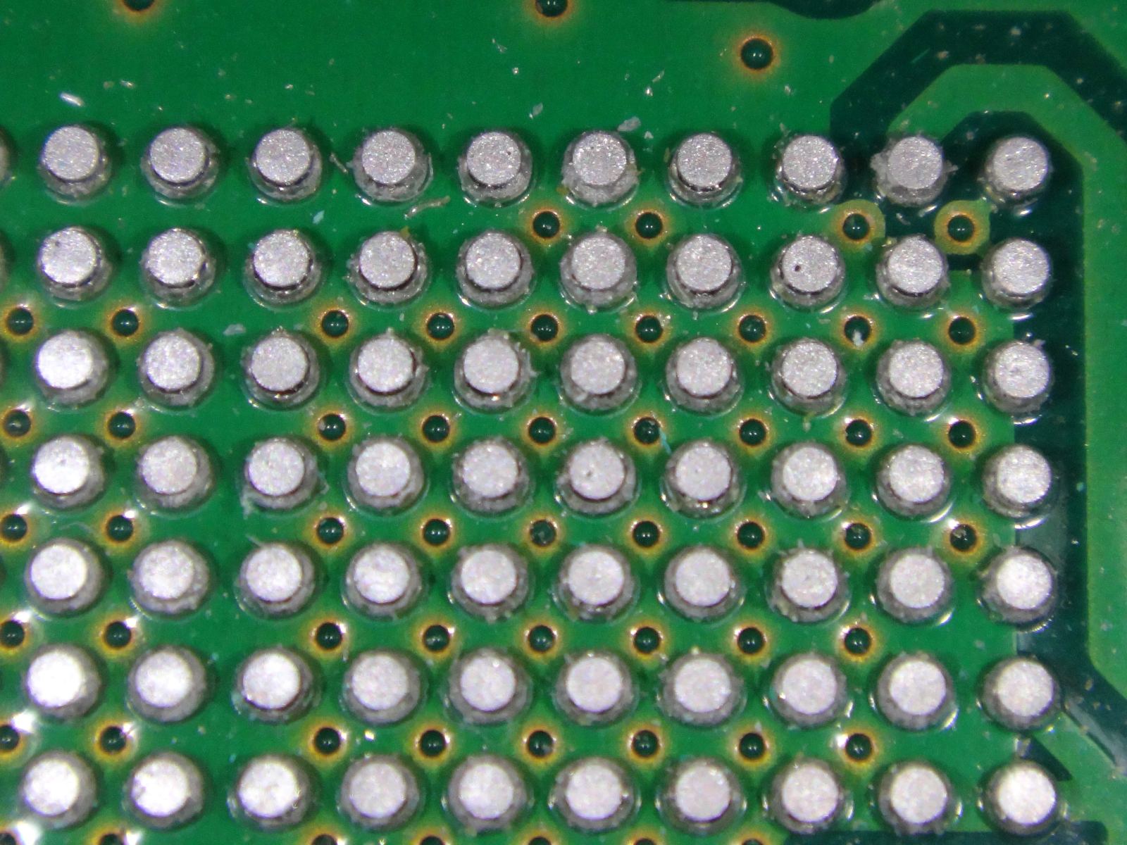 Microscopic view of high-density solder ball grid array packaging interconnects