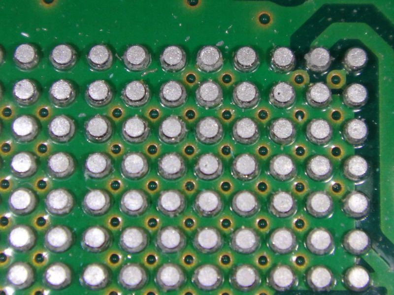Microscopic view of high-density solder ball grid array packaging interconnects