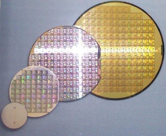 Silicon wafers across various lithography scales highlighting semiconductor fabrication evolution for high-density server processors