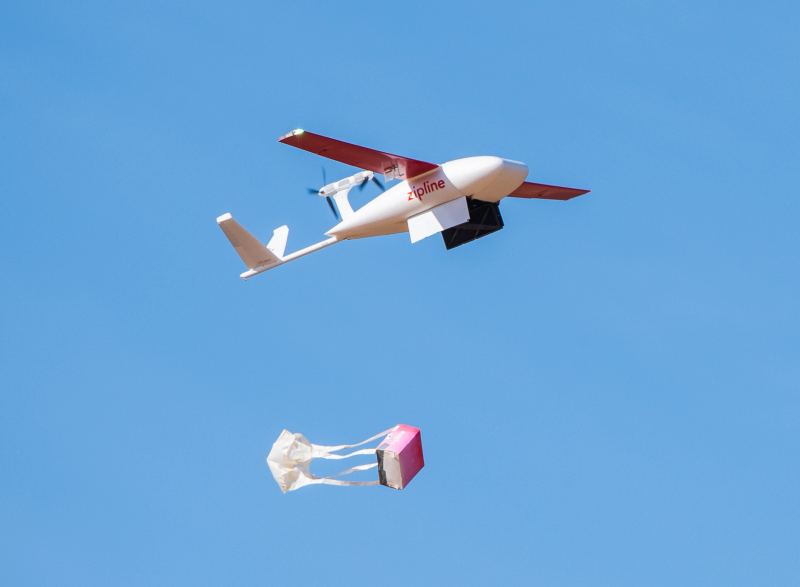 Autonomous aerial delivery drone dropping a cargo container, representing the scaling of automated airborne delivery networks