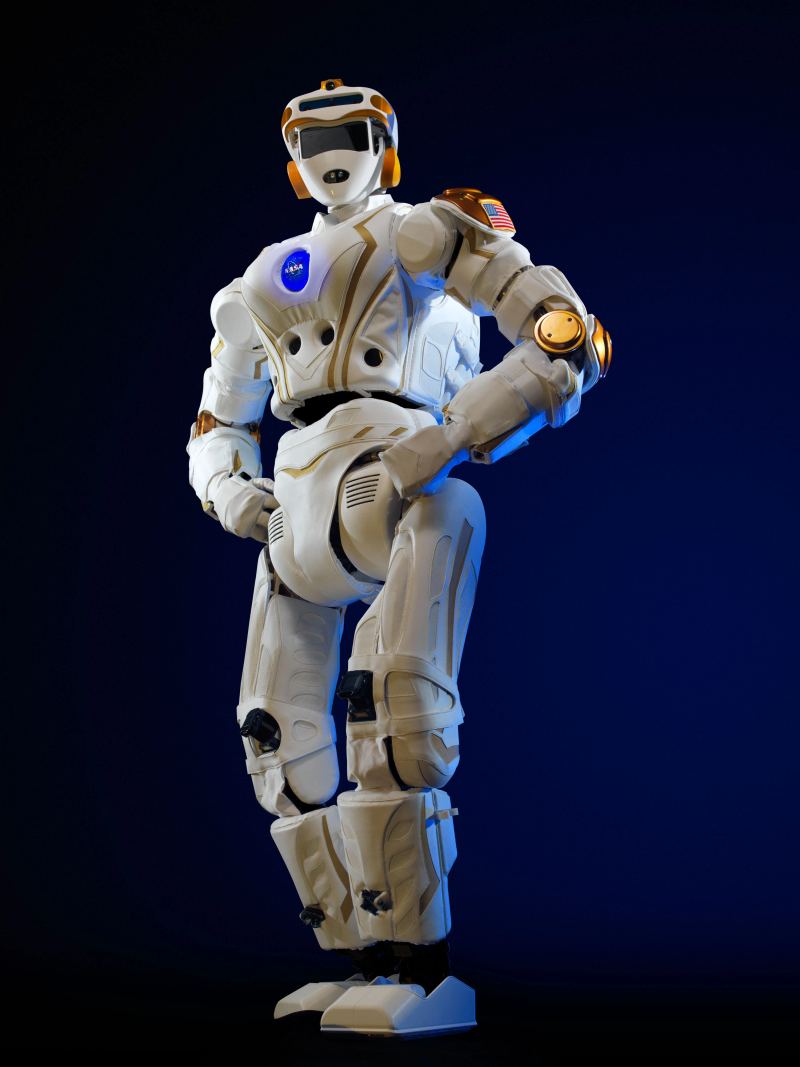 Humanoid bipedal robotic platform Valkyrie displaying articulated upper torso manipulators and stereoscopic sensor head assembly