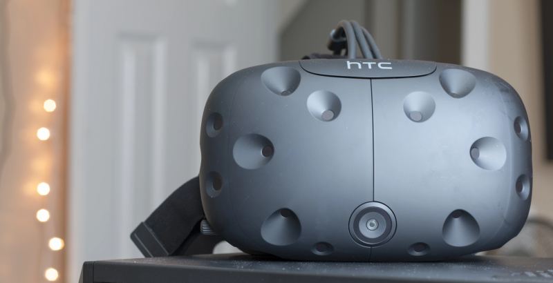 Front view of an ergonomic virtual reality headset equipped with integrated tracking lenses and facial interface.
