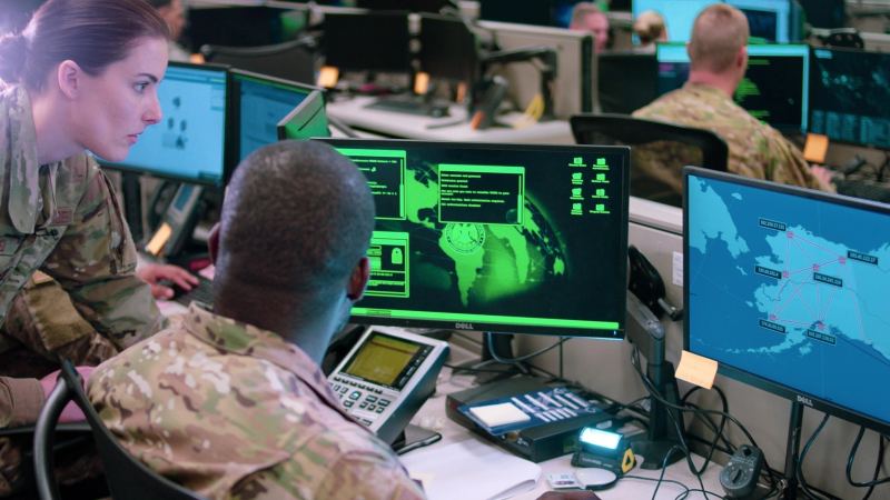Cybersecurity operations center intelligence specialists executing automated vulnerability audits and network threat simulations