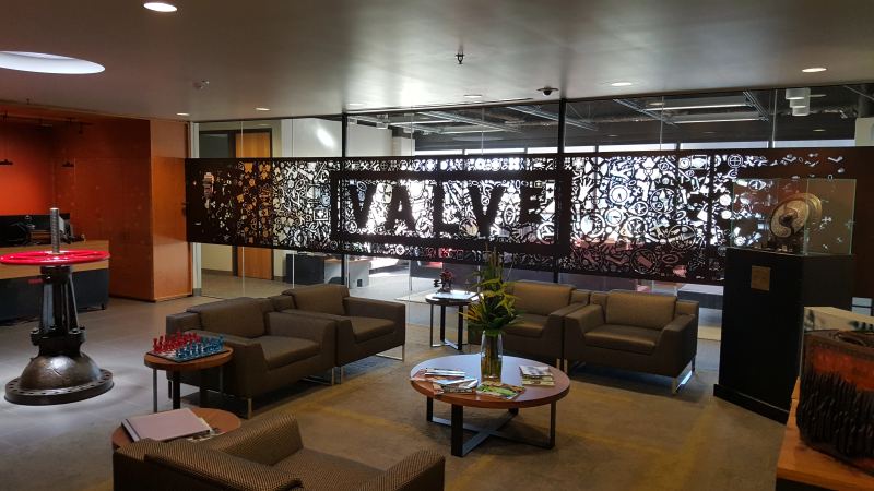 Valve Corporation headquarters reception lobby featuring the iconic red valve wheel in Bellevue Washington