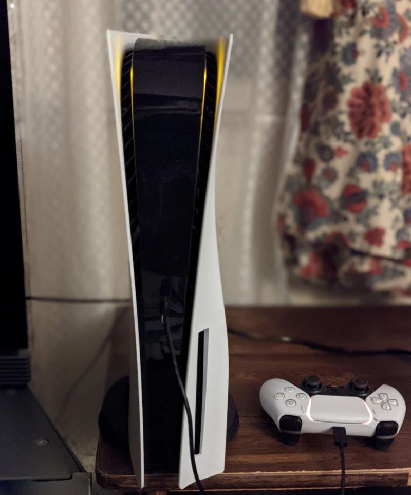 PlayStation 5 console and DualSense wireless controller representing Sony next-generation interactive hardware platform