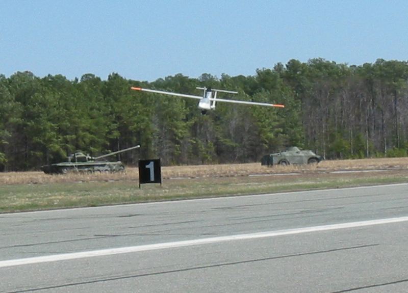 Fixed-wing unmanned aerial vehicle returning from an autonomous long-range flight mission