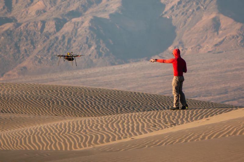Autonomous aerial rotorcraft undergoing aerodynamic stability and navigation trials for long-range autonomous delivery