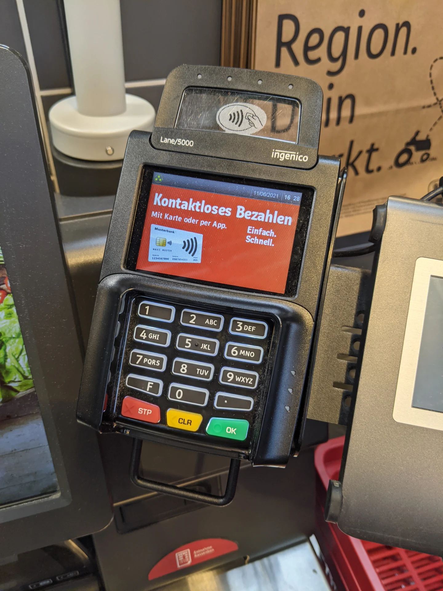Point-of-sale electronic transaction processing terminal handling encrypted consumer and merchant payment cards