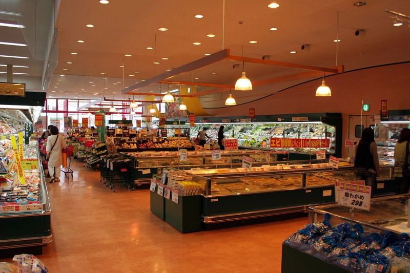 Retail supermarket grocery store interior displaying organized product shelving and commercial point-of-sale layout