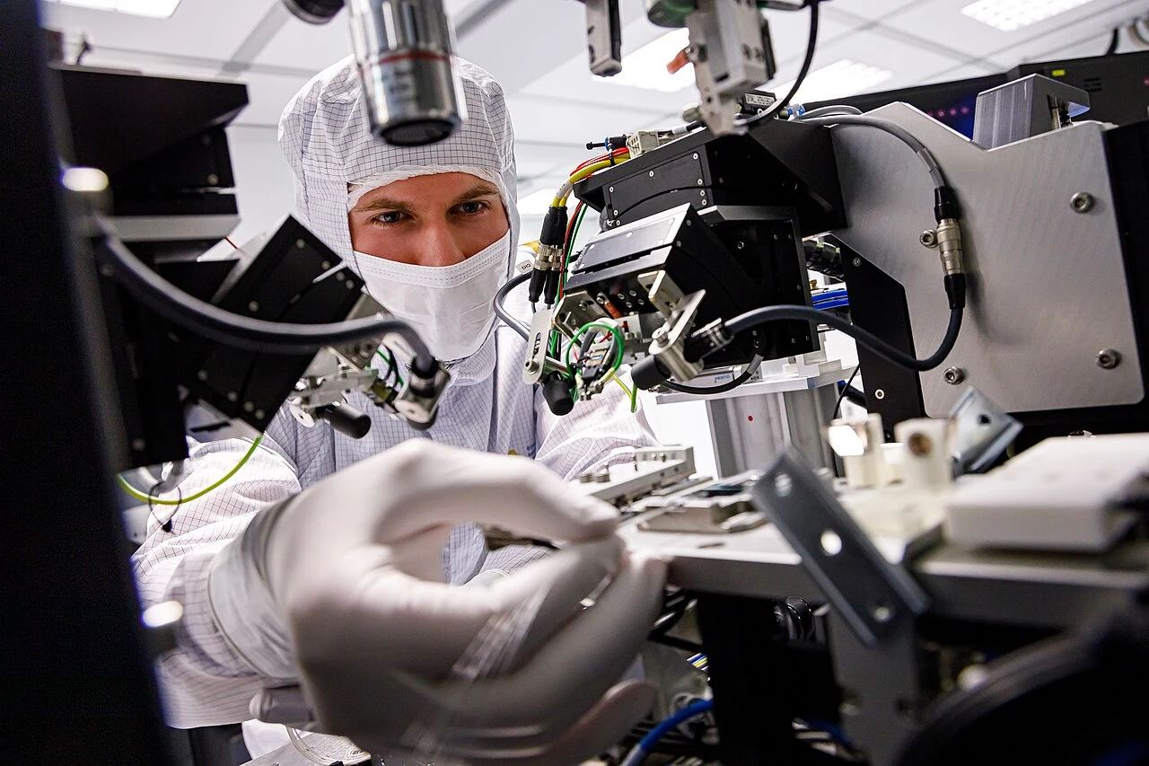 Microfabrication research laboratory and cleanroom engineering team conducting advanced silicon device prototyping