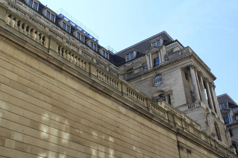 Central banking architectural facade symbolizing regulated monetary reserves, sovereign debt issuance, and liquidity management