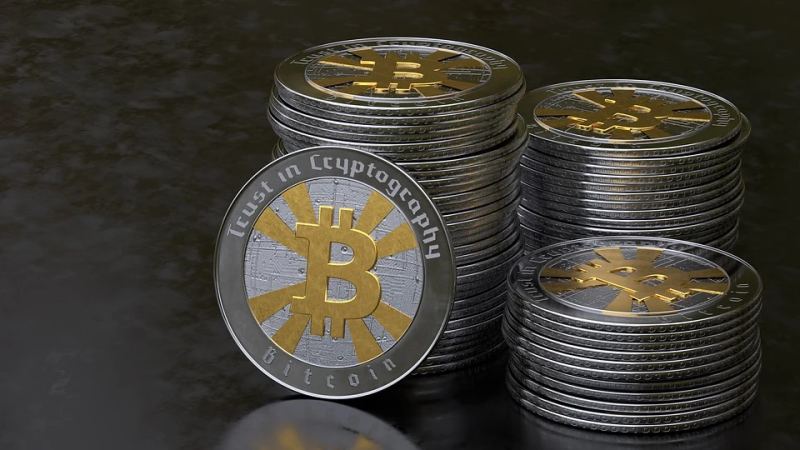 Stack of physical Bitcoin cryptocurrency tokens representing digital asset collateral