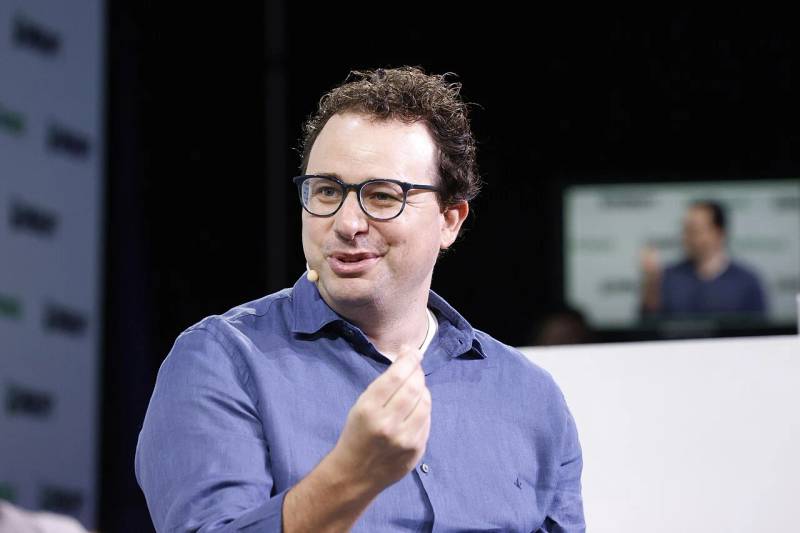 Dario Amodei speaking onstage at TechCrunch Disrupt regarding AI safety and frontier model evaluations.