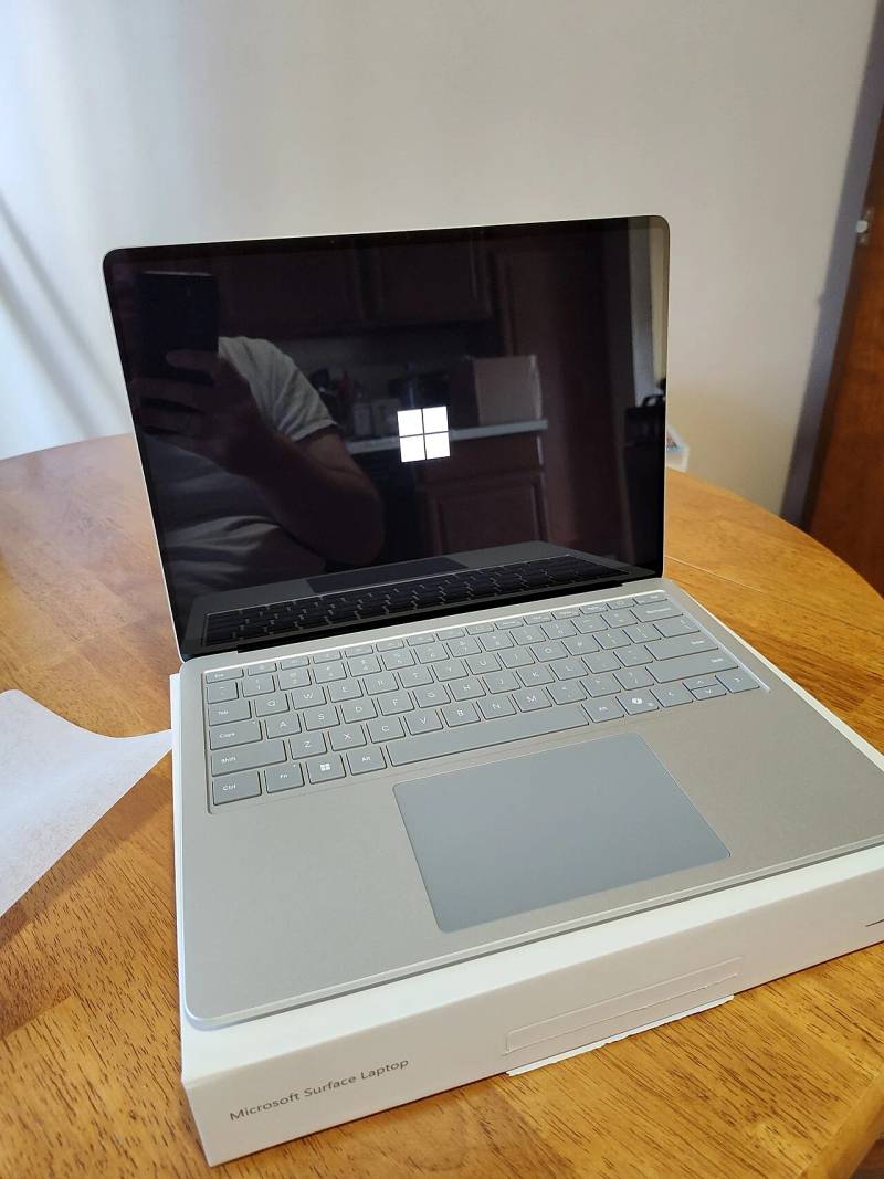 Sleek aluminum unibody enclosure and display profile representing modern Microsoft Surface laptop engineering.
