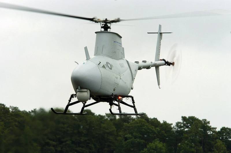 Unmanned vertical takeoff aerial vehicle conducting flight operations monitored by traffic management systems.