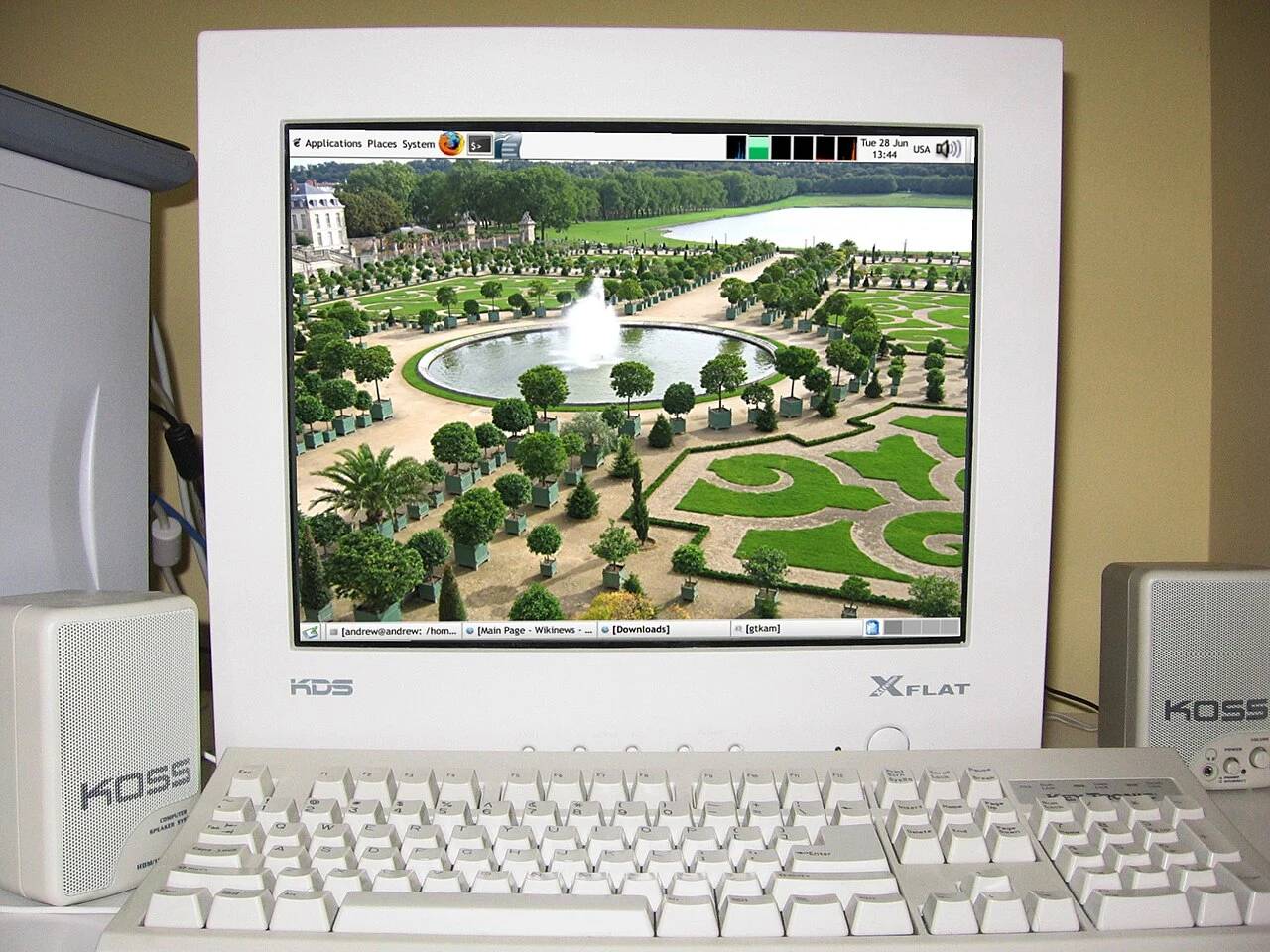 Computer monitor displaying simulated operating system software and terminal logs.