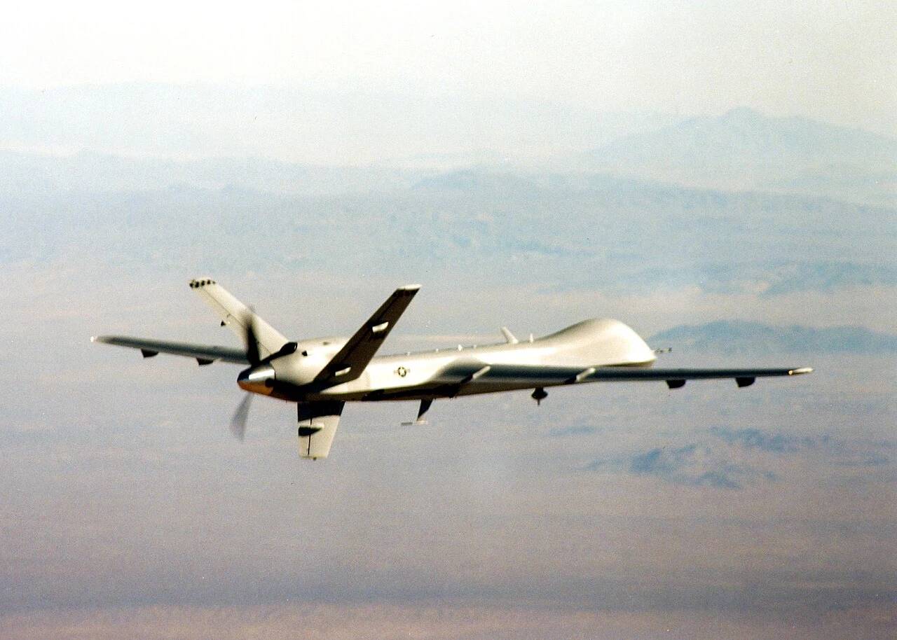 Tactical military unmanned aerial vehicle in flight across open airspace.