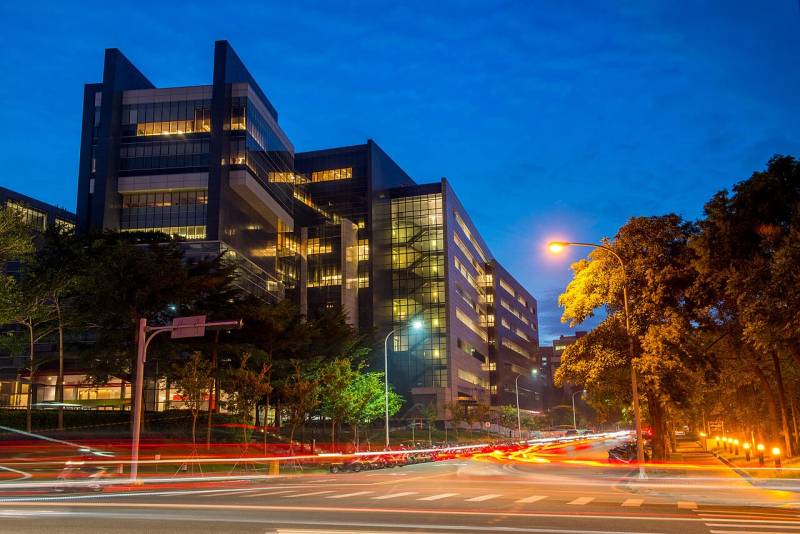 Semiconductor manufacturing cleanroom and fabrication plant operated by TSMC where custom AI inference chips are manufactured.