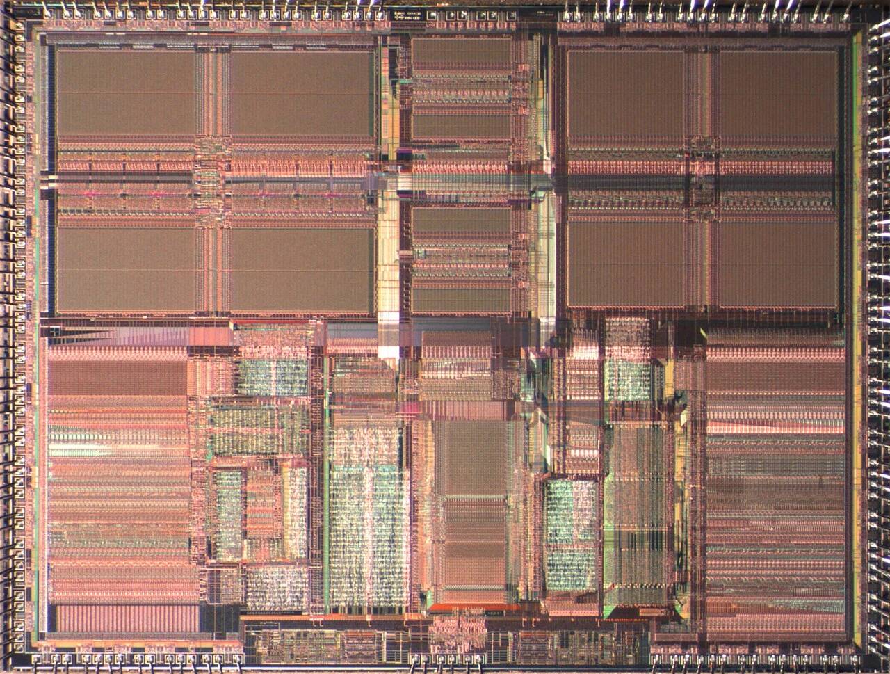 High-resolution macro silicon die shot showing CPU execution units, cache hierarchy, and integrated controller silicon blocks.