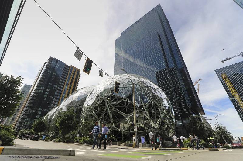 Architectural exterior of Amazon corporate campus in Seattle, representing retail and cloud infrastructure enterprises instituting agent security controls.