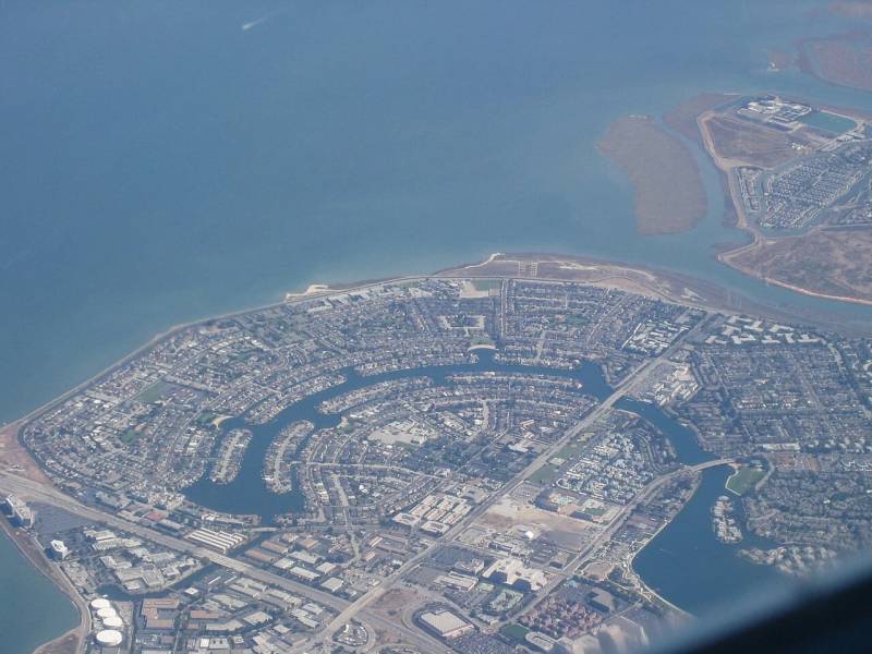 Aerial view of Foster City technology and financial corridor, home to global payment network headquarters and multinational settlement infrastructure.