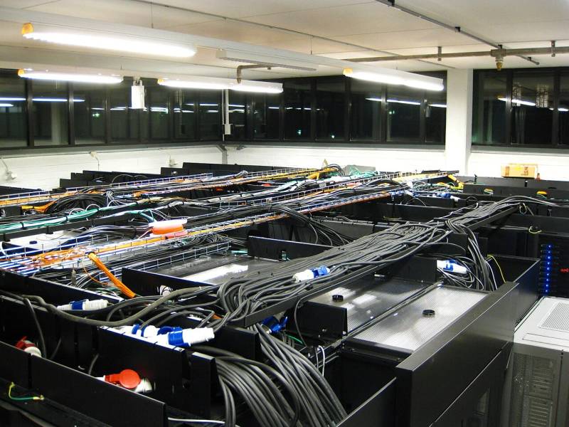 Hyperscale enterprise server room hosting AWS Trainium compute clusters for deep learning workloads.