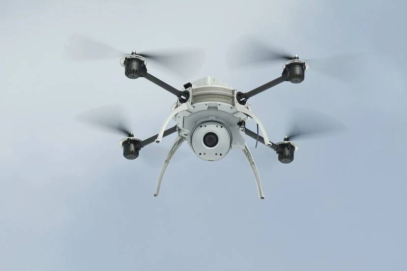 Autonomous aerial drone with specialized onboard optical camera payload designed for precision flight navigation and situational awareness.