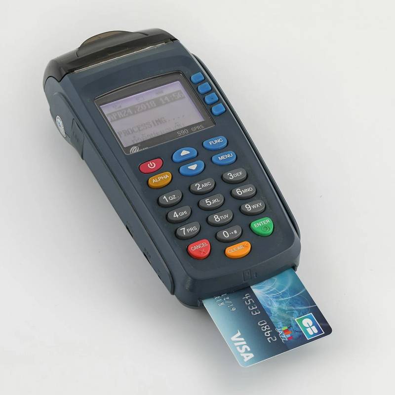 Retail merchant contactless payment card terminal processing instant electronic payments and decentralized digital balance transactions.