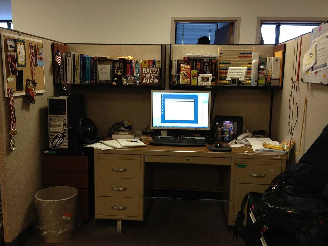 Developer workstation displaying systems engineering code and terminal consoles for building sandboxed software runtimes.