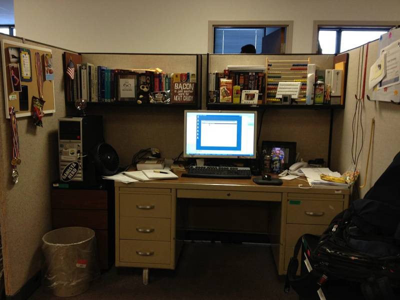 Developer workstation displaying systems engineering code and terminal consoles for building sandboxed software runtimes.