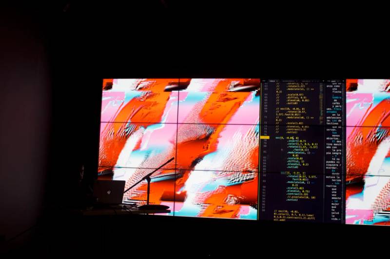 Full-screen software development terminal showing live syntax editing and automated vulnerability scanning scripts.